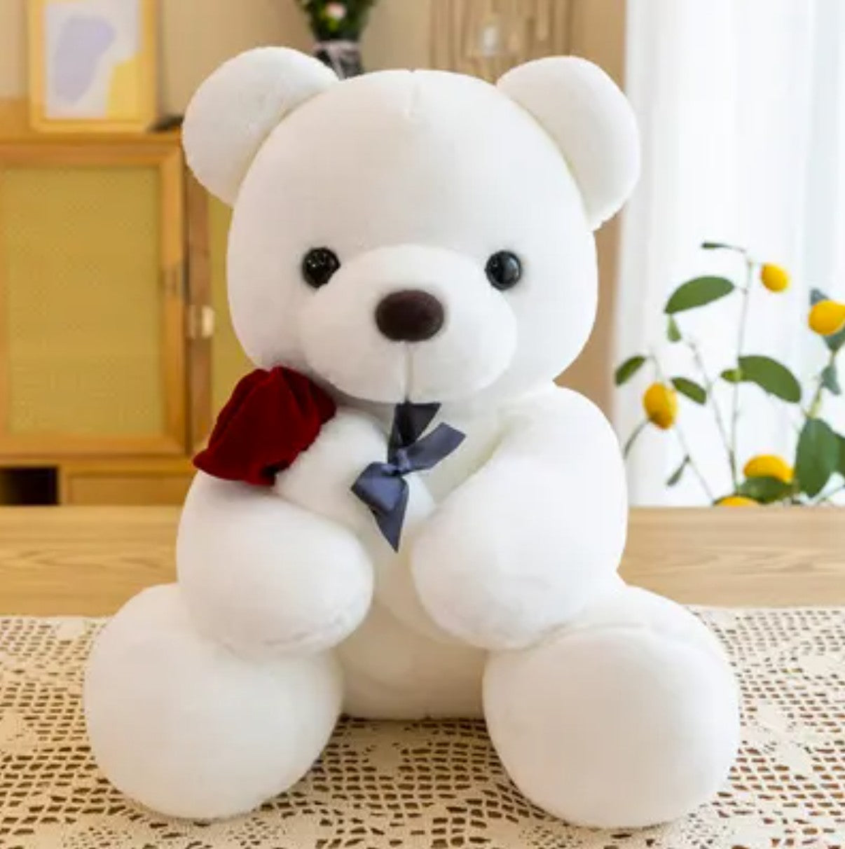 Adorable Teddy Bear Holding a Rose